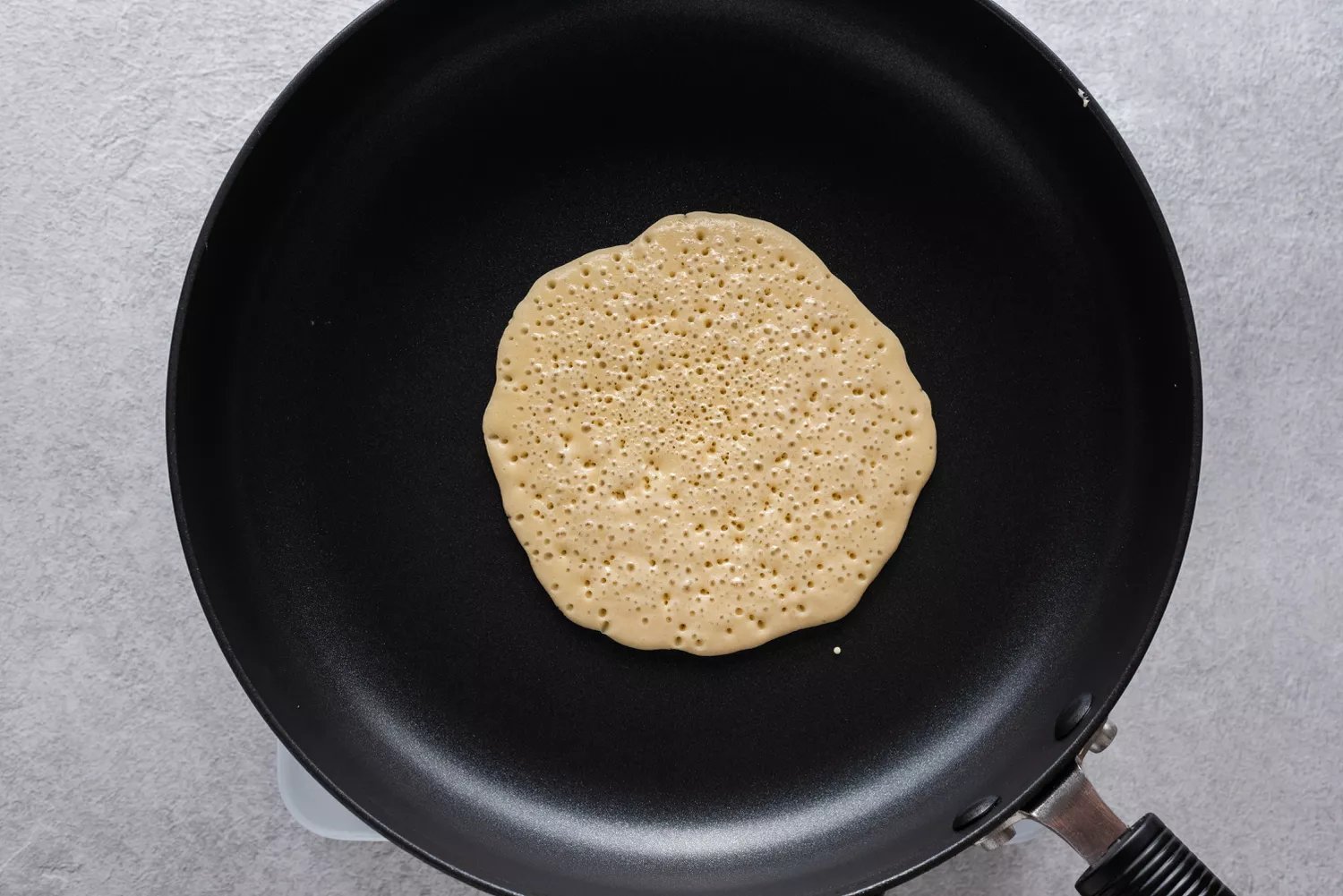 Pancake cooking in a skillet
