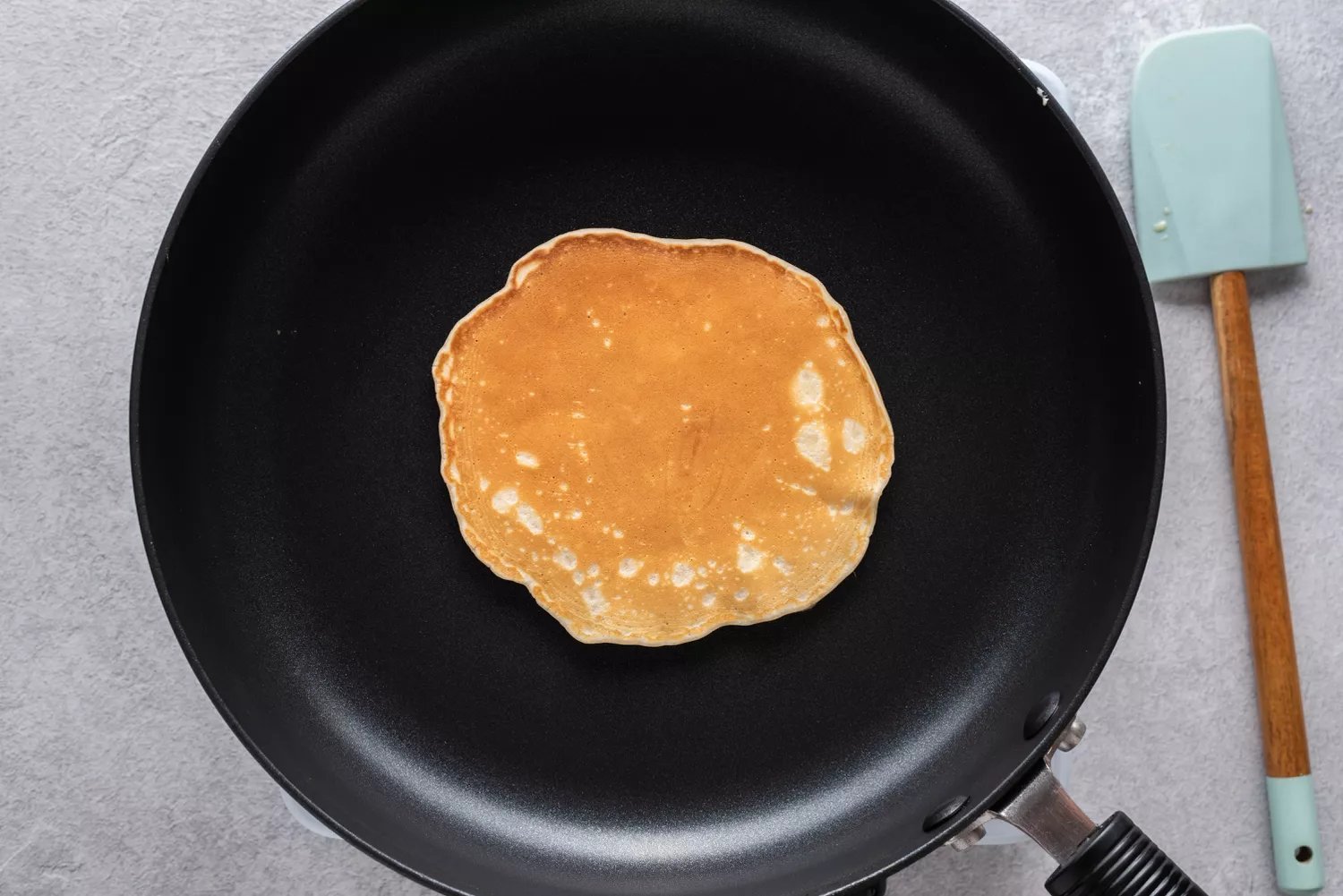 Pancake in a skillet, flipped