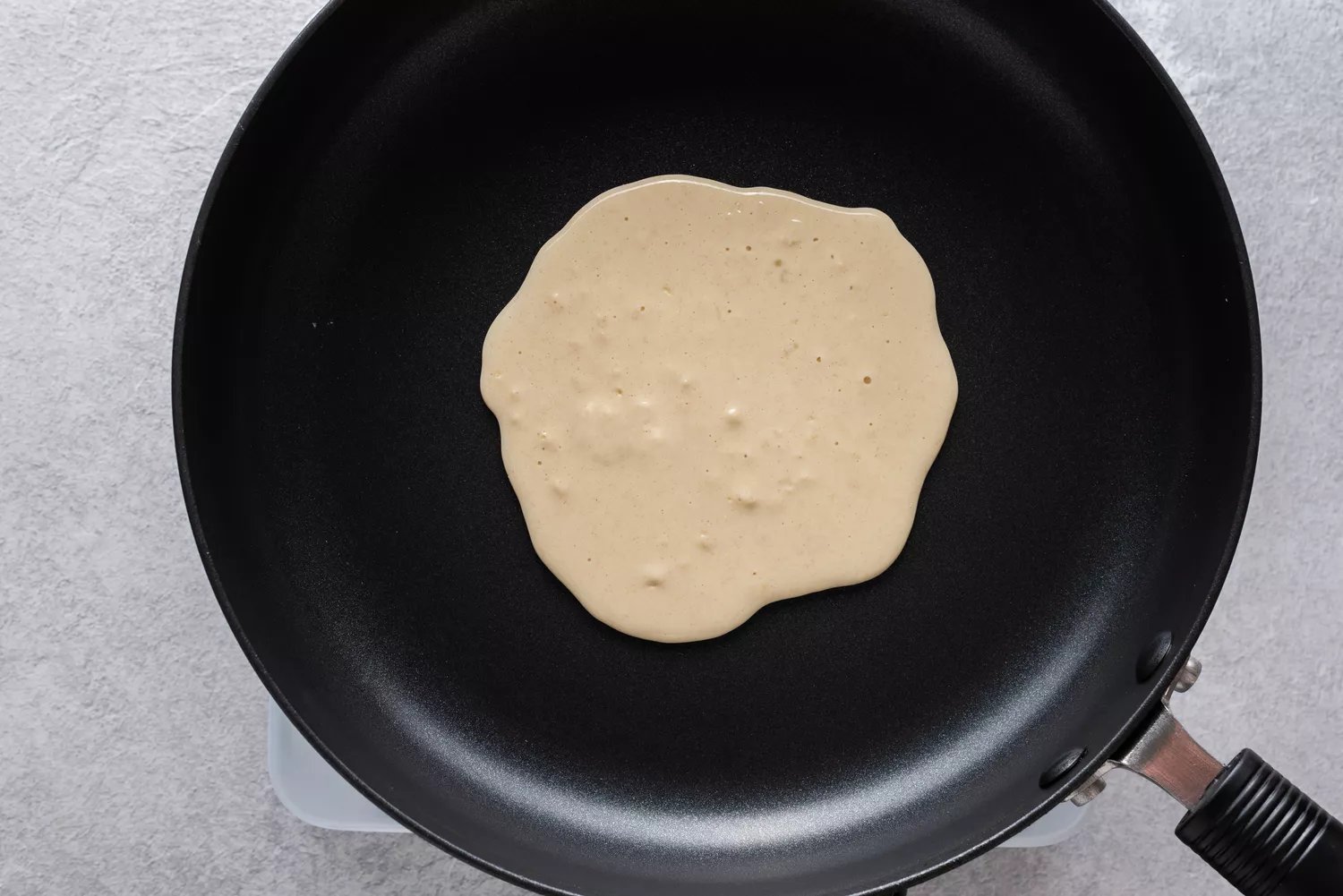 Pancake batter in a skillet